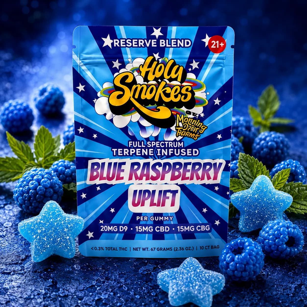 The blue Blue Raspberry Uplift pouch on a dark blue surface, surrounded by blue raspberries, mint leaves and sugared blue star gummies.