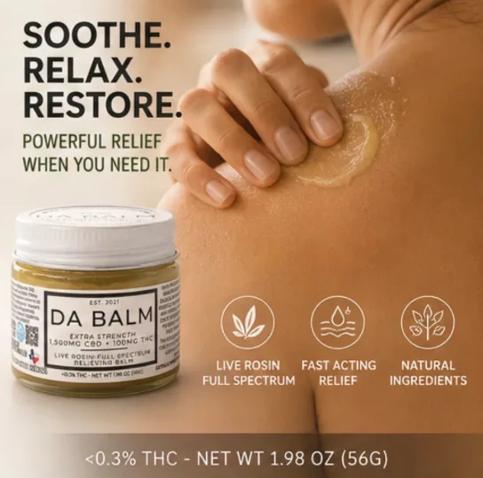 A close-up of a person's bare shoulder with a swirl of golden balm being smoothed across the skin by three fingers. The open jar sits at the lower left with its lid off, showing the olive-gold balm inside, and a row of small circular line icons runs underneath.