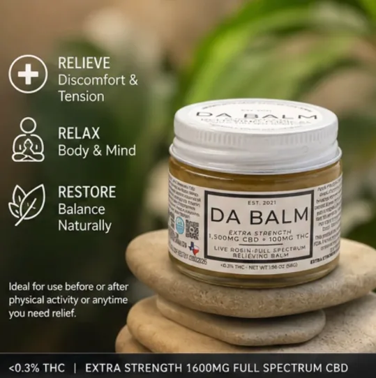 The closed DA BALM jar balanced on a stack of smooth pale river stones, with a large blurred green houseplant filling the background. Small icons and short lines of text run down the left side of the image.